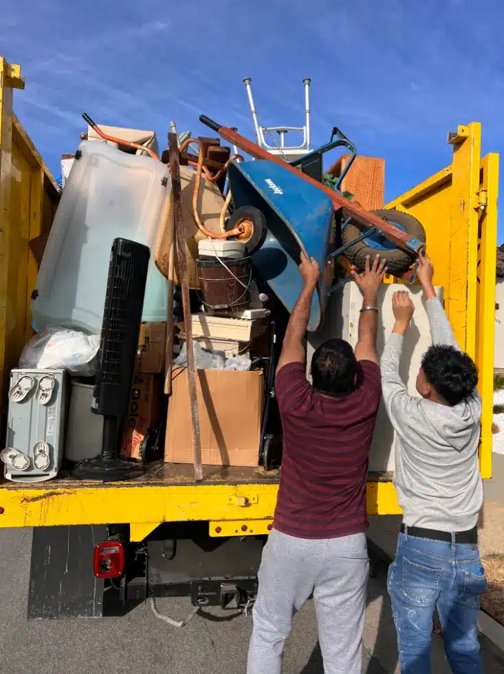 Dumpster Truck Filled With Junk